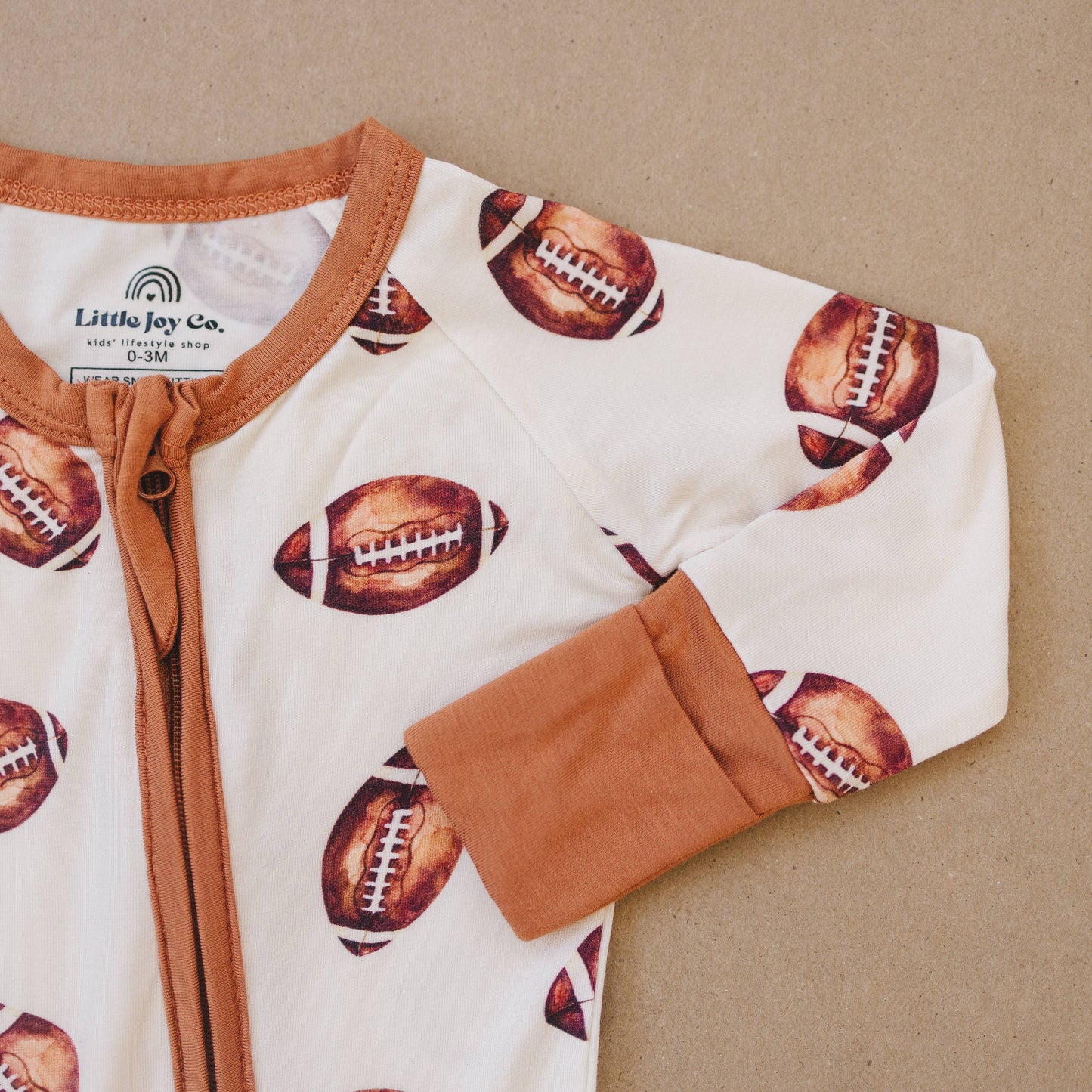Little Joy Co. - Football Print Bamboo Zippy Romper  IN STOCK